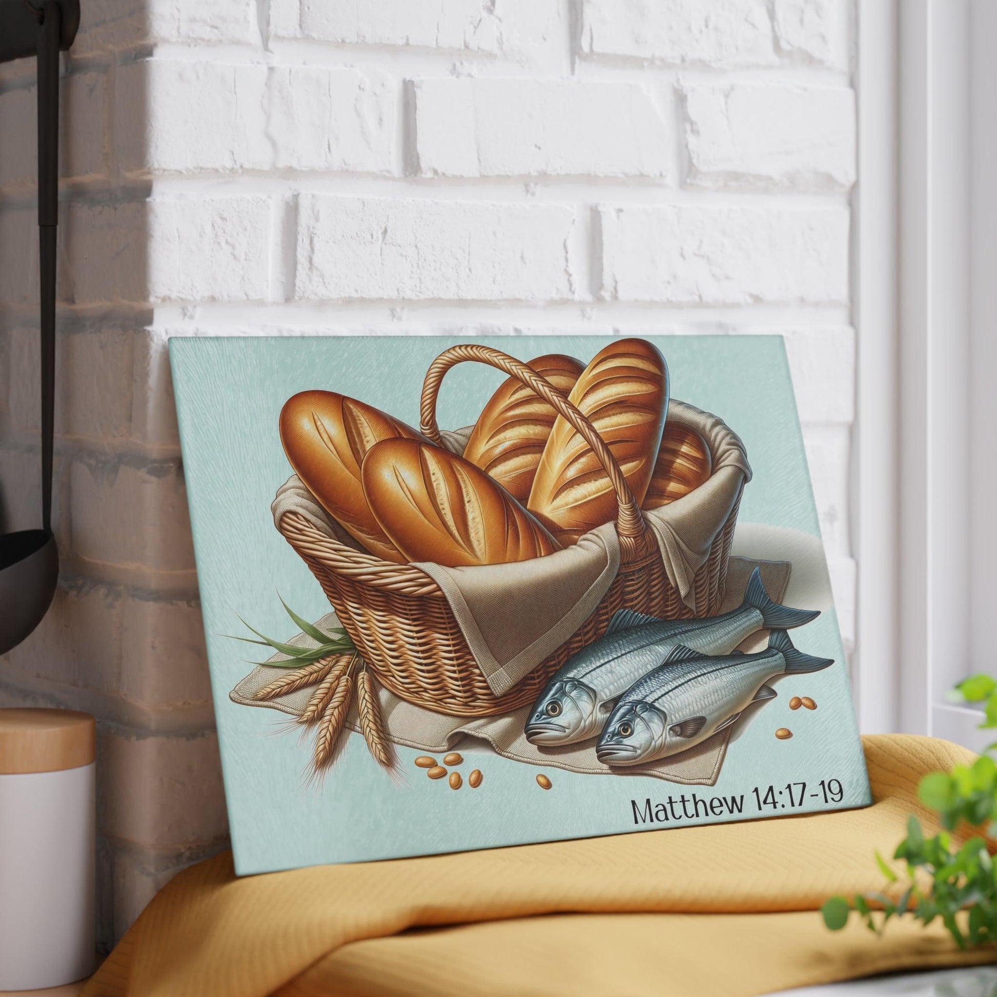 5 loaves and 2 fish glass cutting board against wall