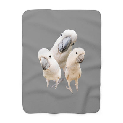 Cockatoo Sherpa Fleece Blanket  facing up on floor