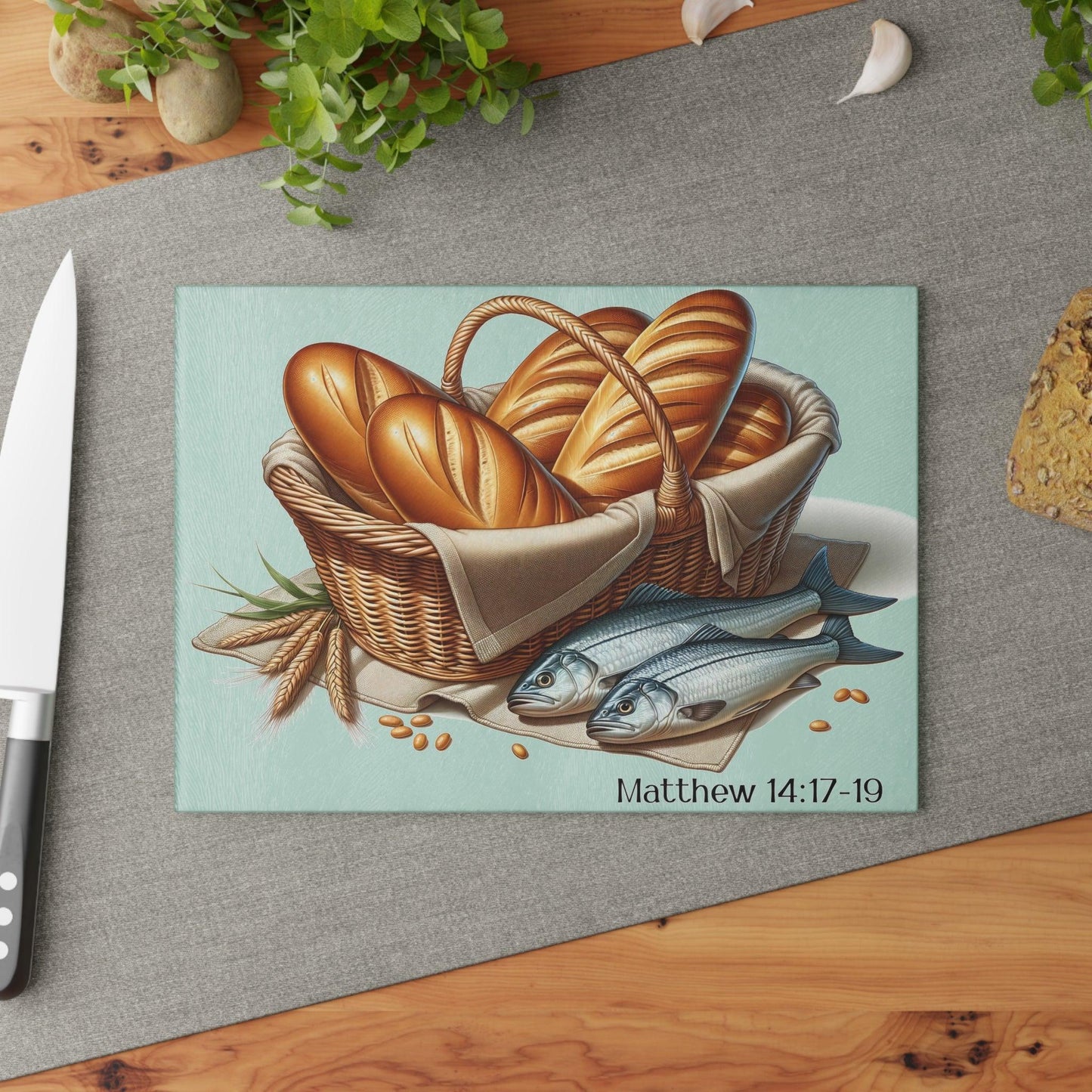 5 loaves and 2 fish glass cutting board on table