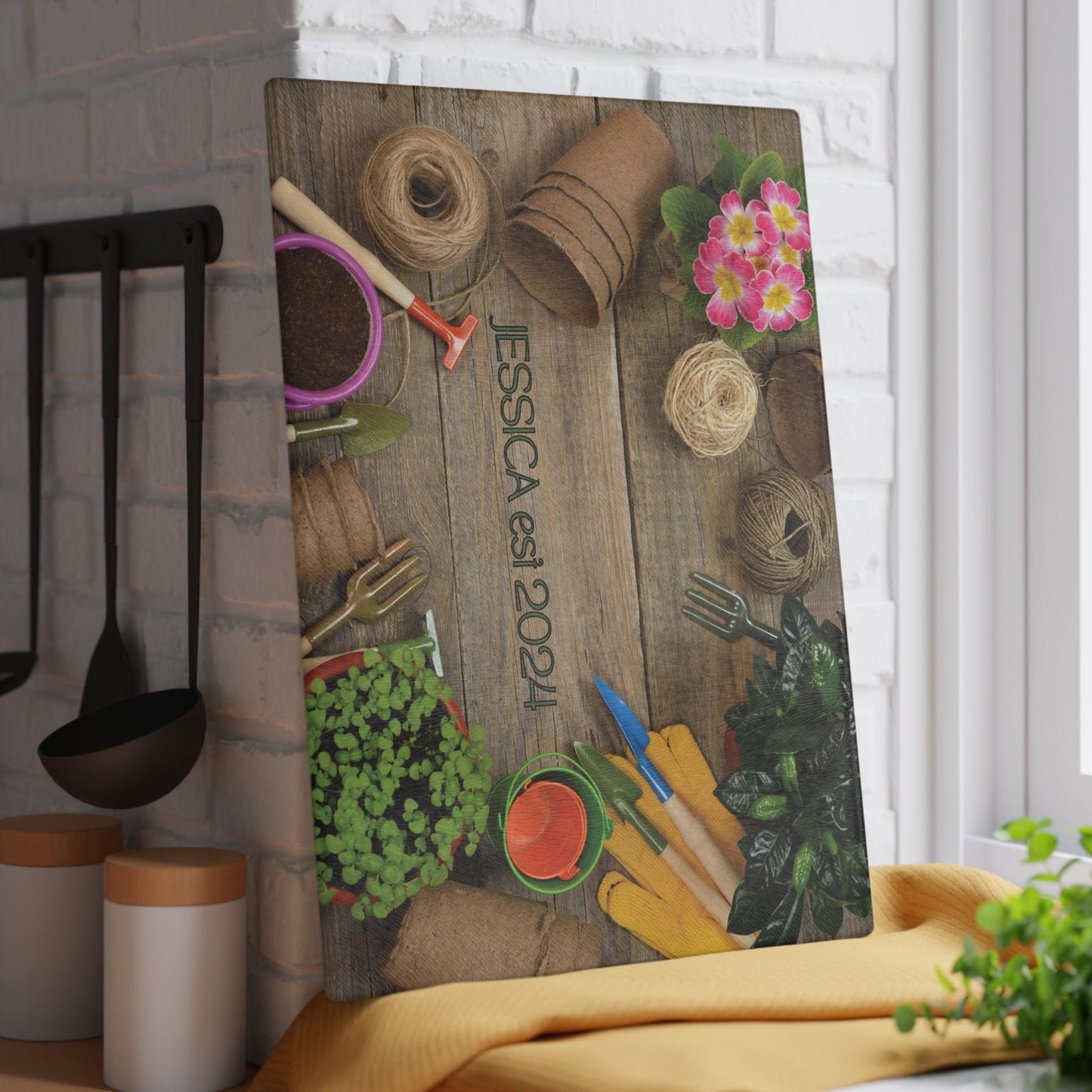 Personalized Garden Glass Cutting Board vertical against wall