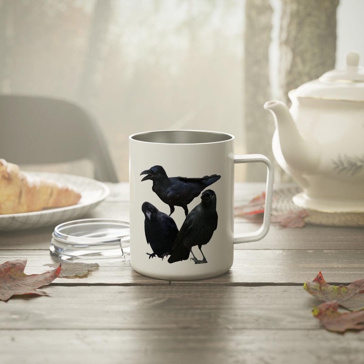 crow insulated mug on table