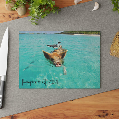 Pig and Bird Swimming in the Ocean Glass Cutting Board table shot