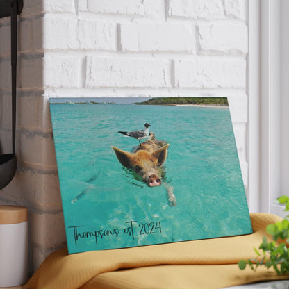 Pig and Bird Swimming in the Ocean Glass Cutting Board against wall