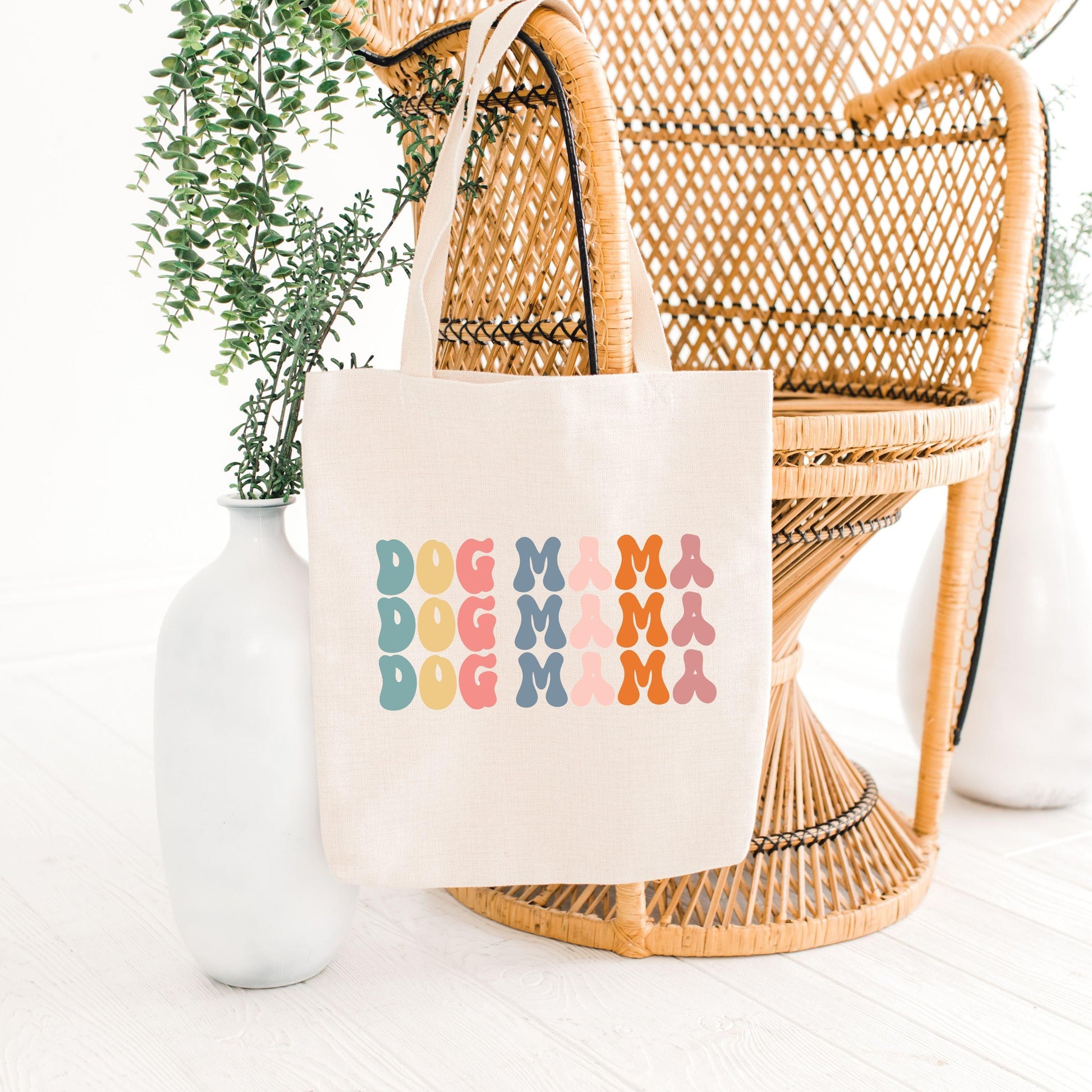 Dog Mama Canvas Tote Bag on chair