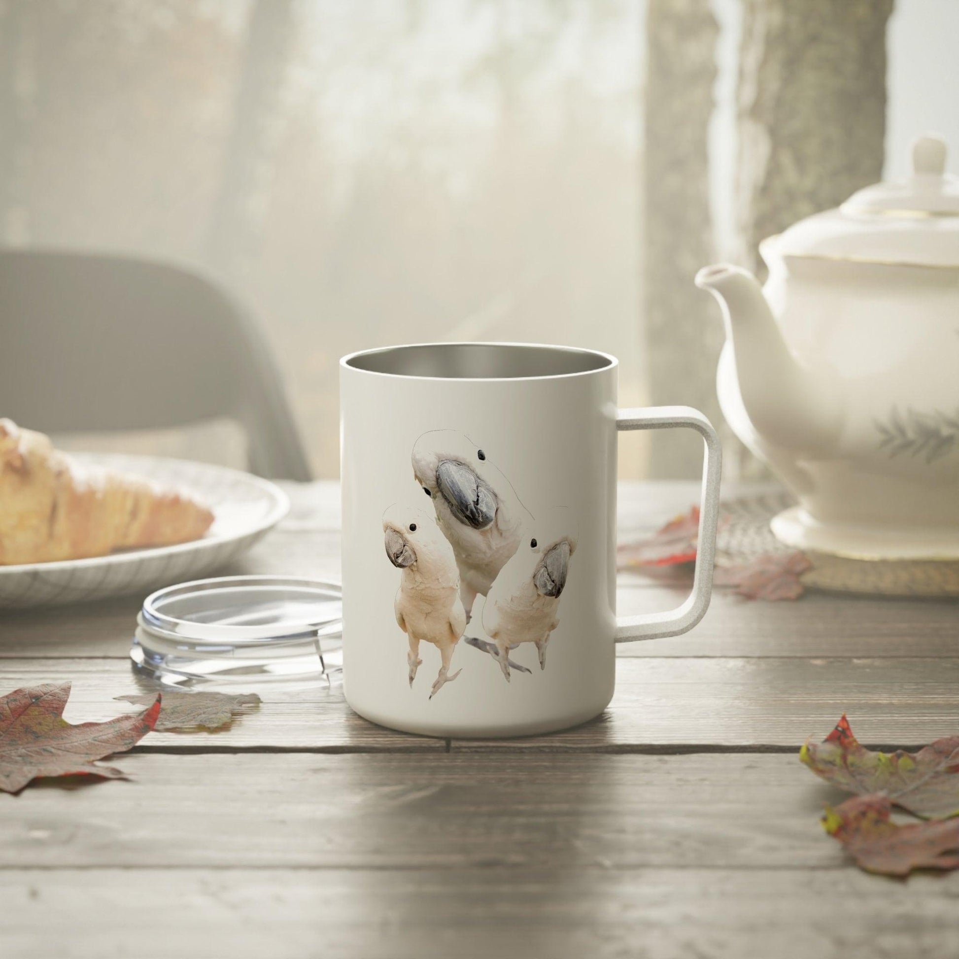 Funny Cockatoo Insulated Coffee Mug on table