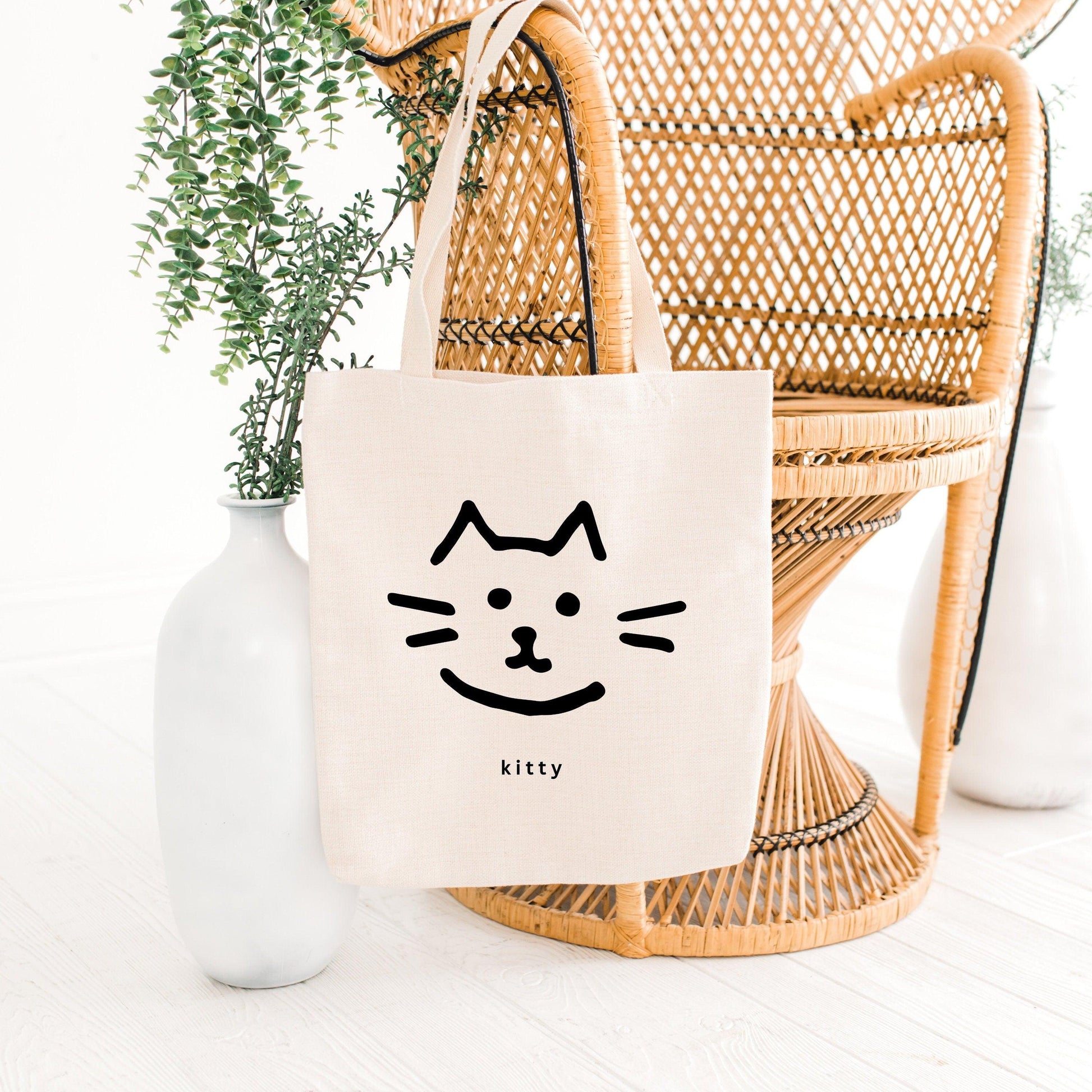 Kitty Cat Canvas Tote Bag on chair