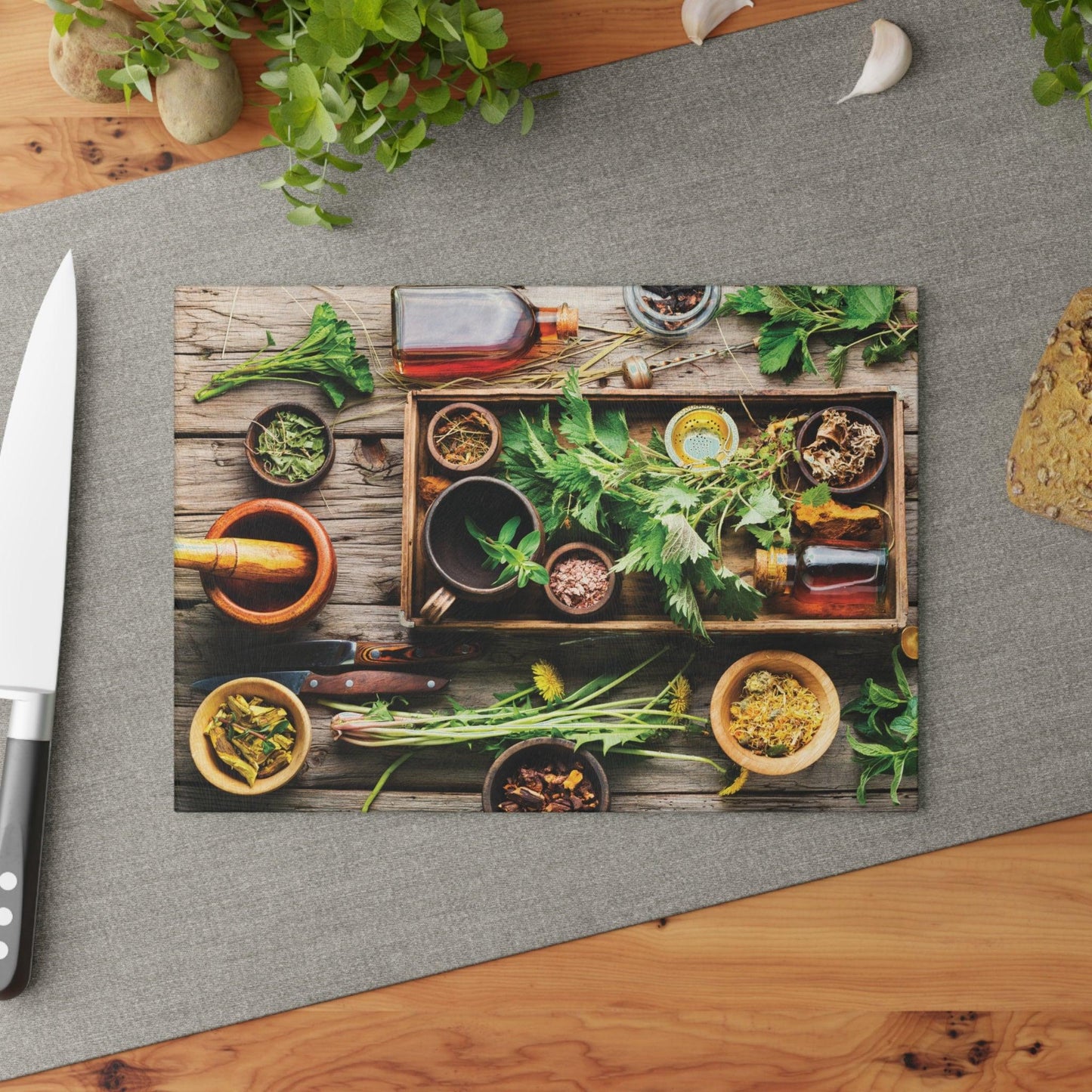 Garden Herbs Glass Cutting Board on table